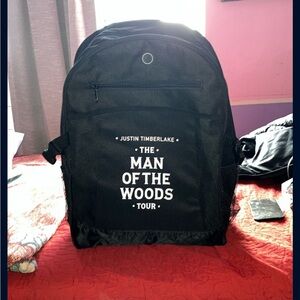Black Canvas Backpack with Bold White Text Casual Design